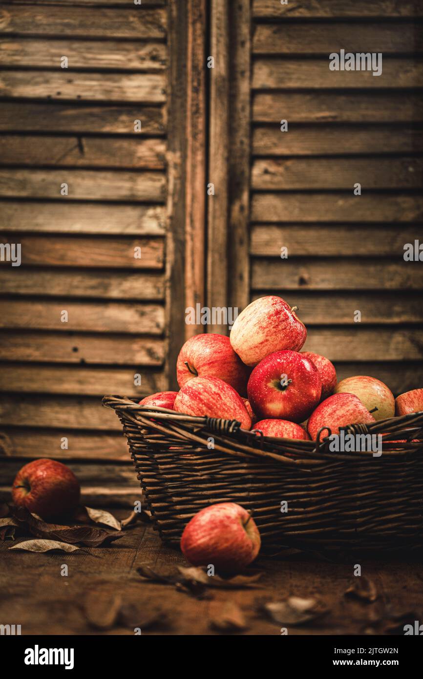 Fresh ripe red appples on a rustic background Stock Photo