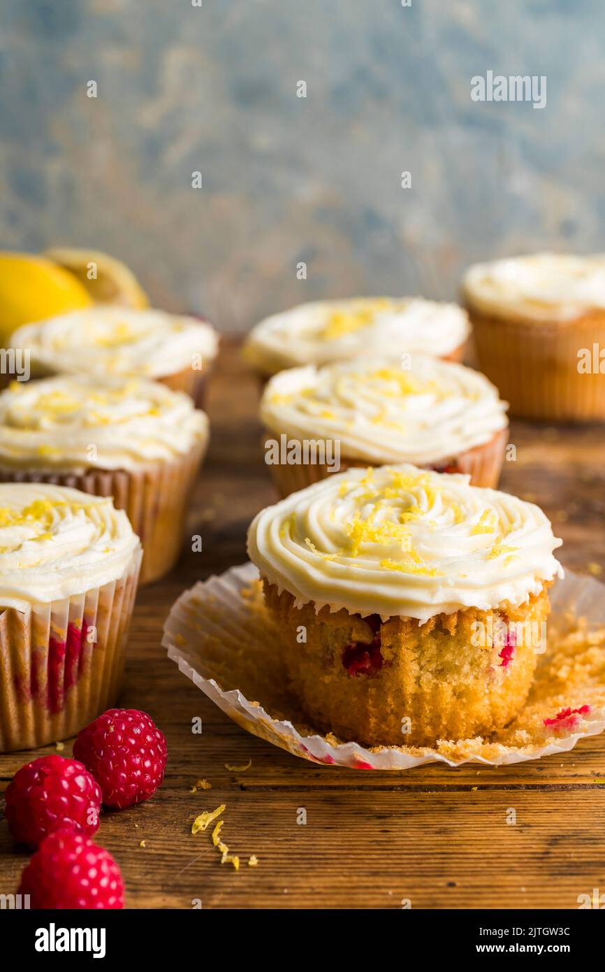 Raspberry muffins with lemon buttercream with muffin case Stock Photo