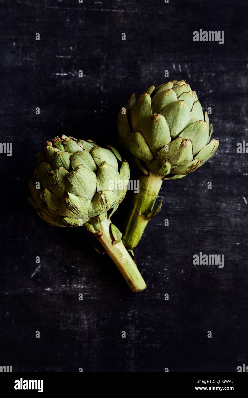Fresh Artichokes on a black background Stock Photo