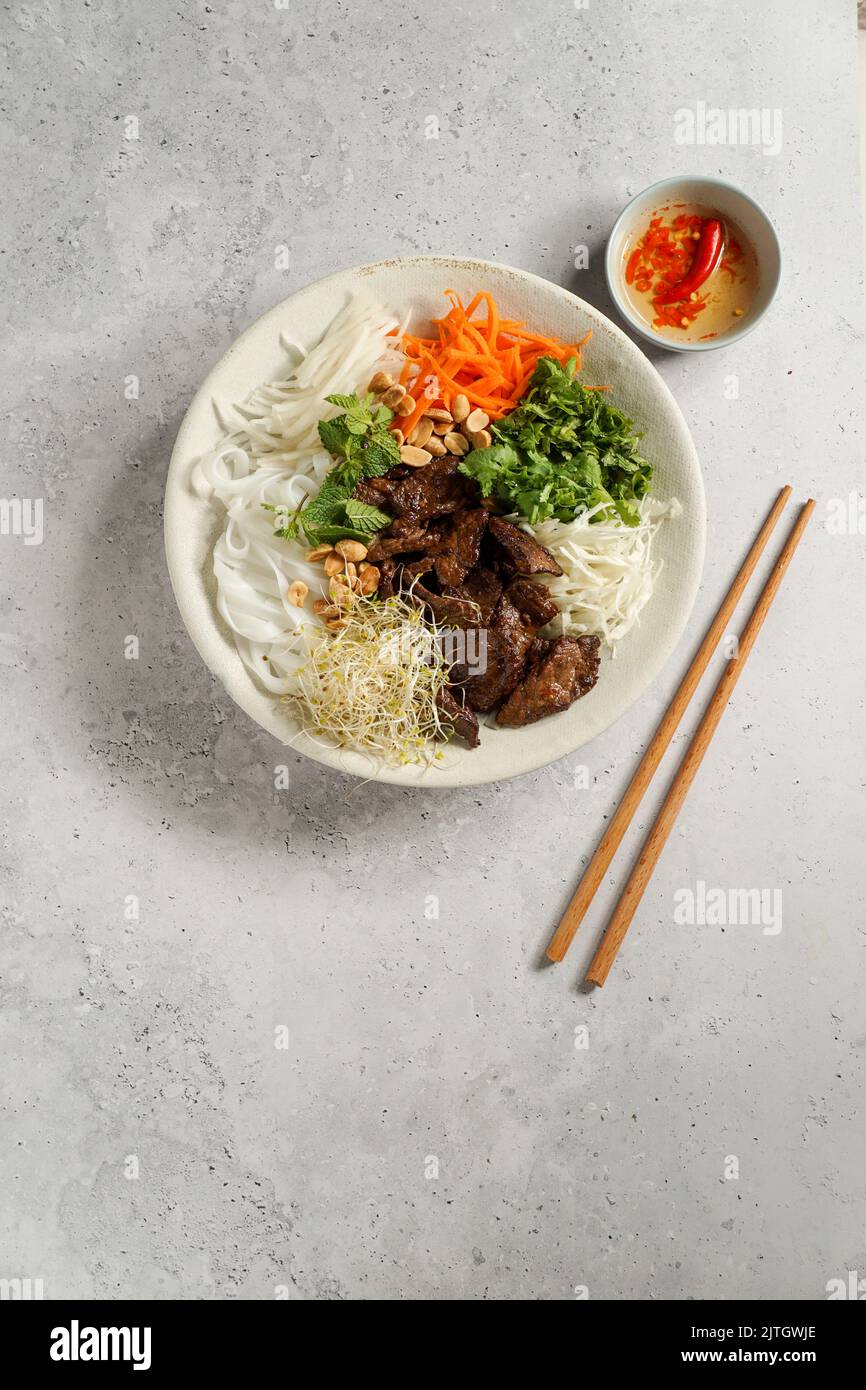 traditional Vietnamese noodle salad Bun Bo Nam Bo, with beef, rice