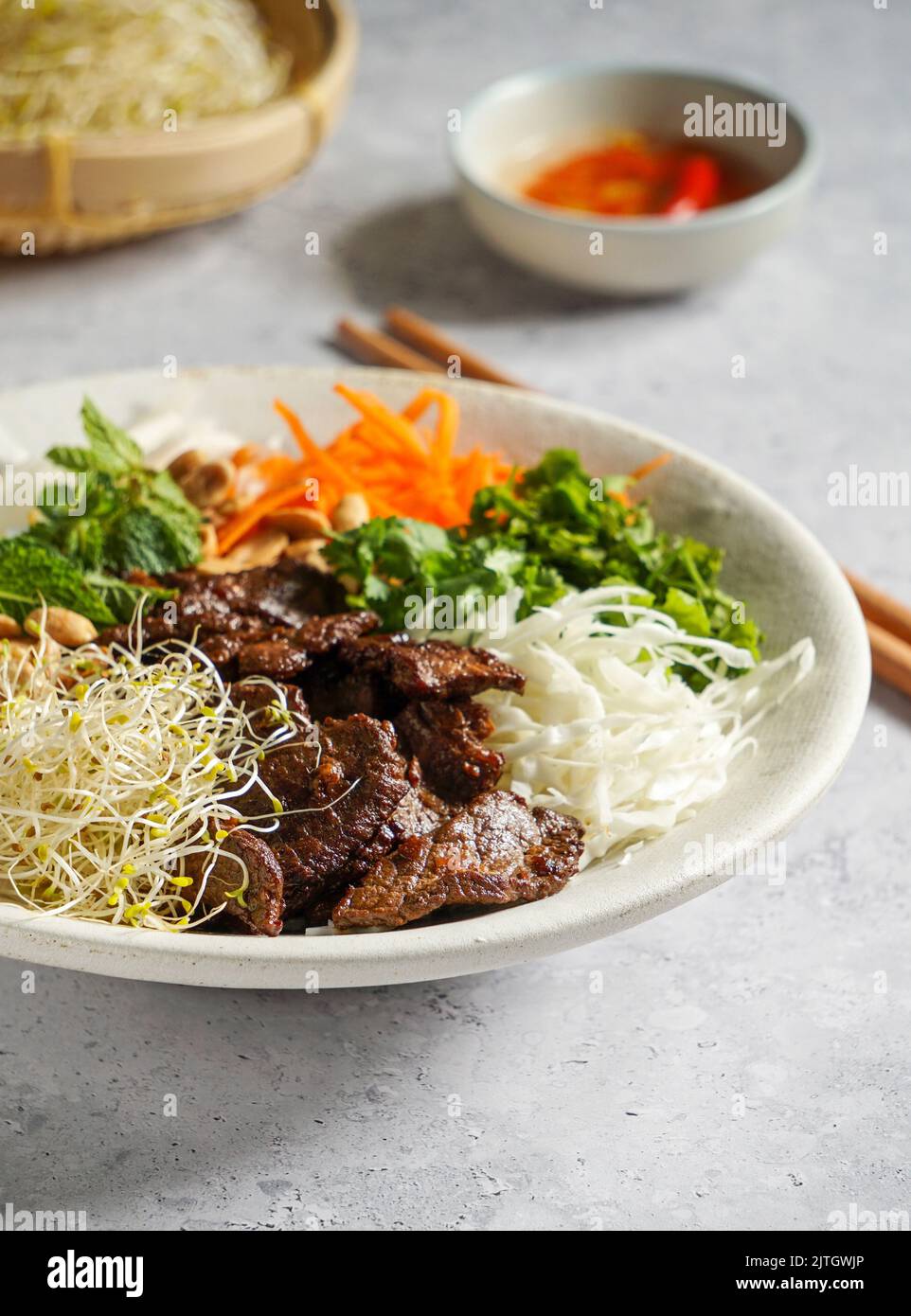 traditional Vietnamese noodle salad Bun Bo Nam Bo, with beef, rice