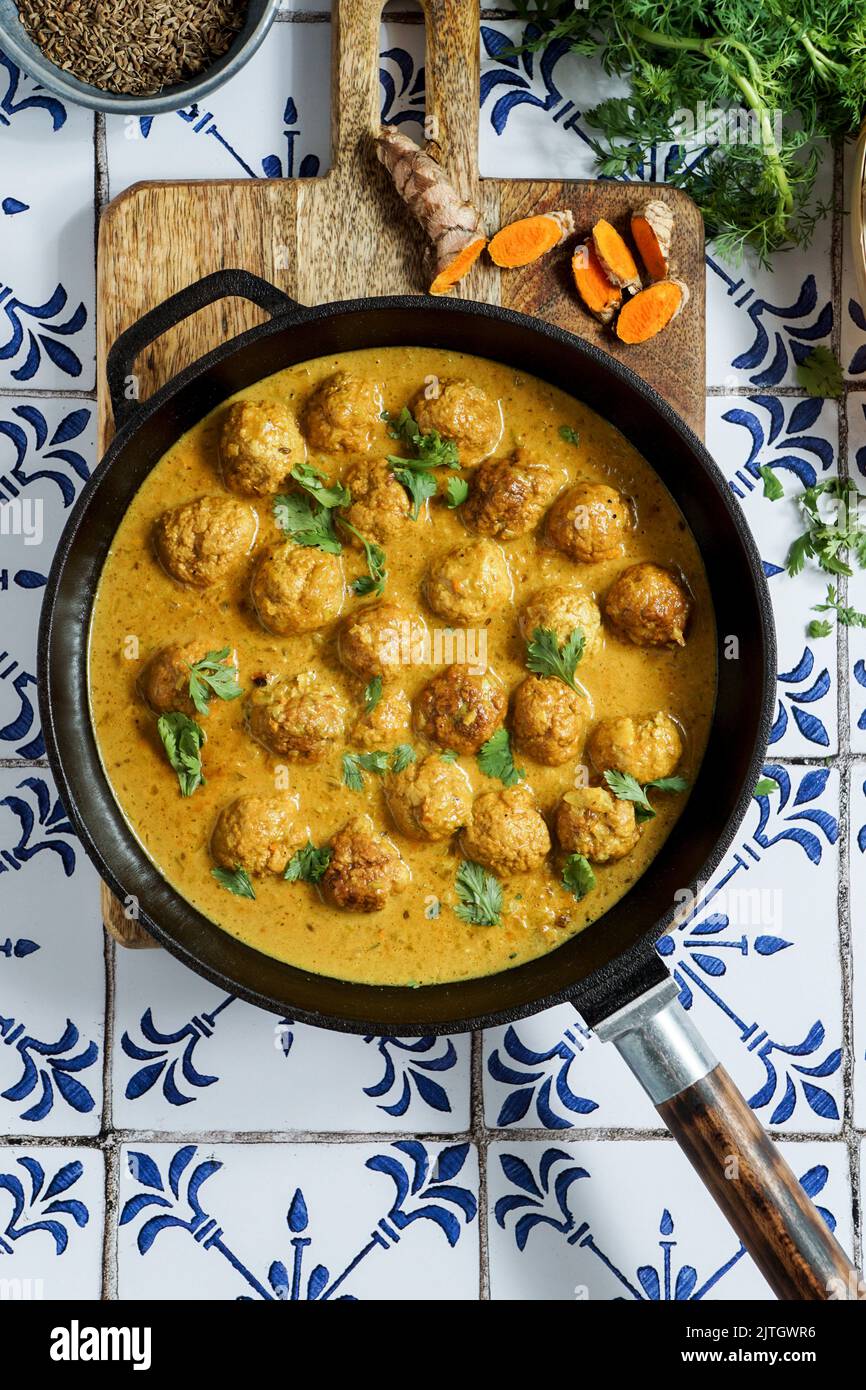 Thai Turkey Meatballs In Coconut Red Curry Sauce with ginger, garlic, and red curry paste Stock Photo