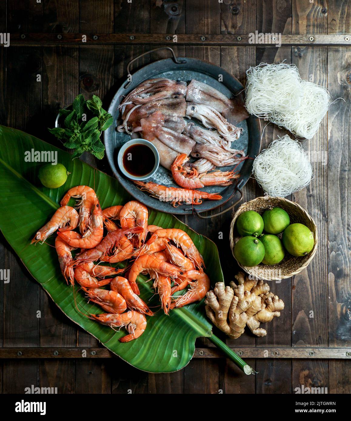 ingredients for Thai cuisine shrimp, rice noodles, mint, green onion