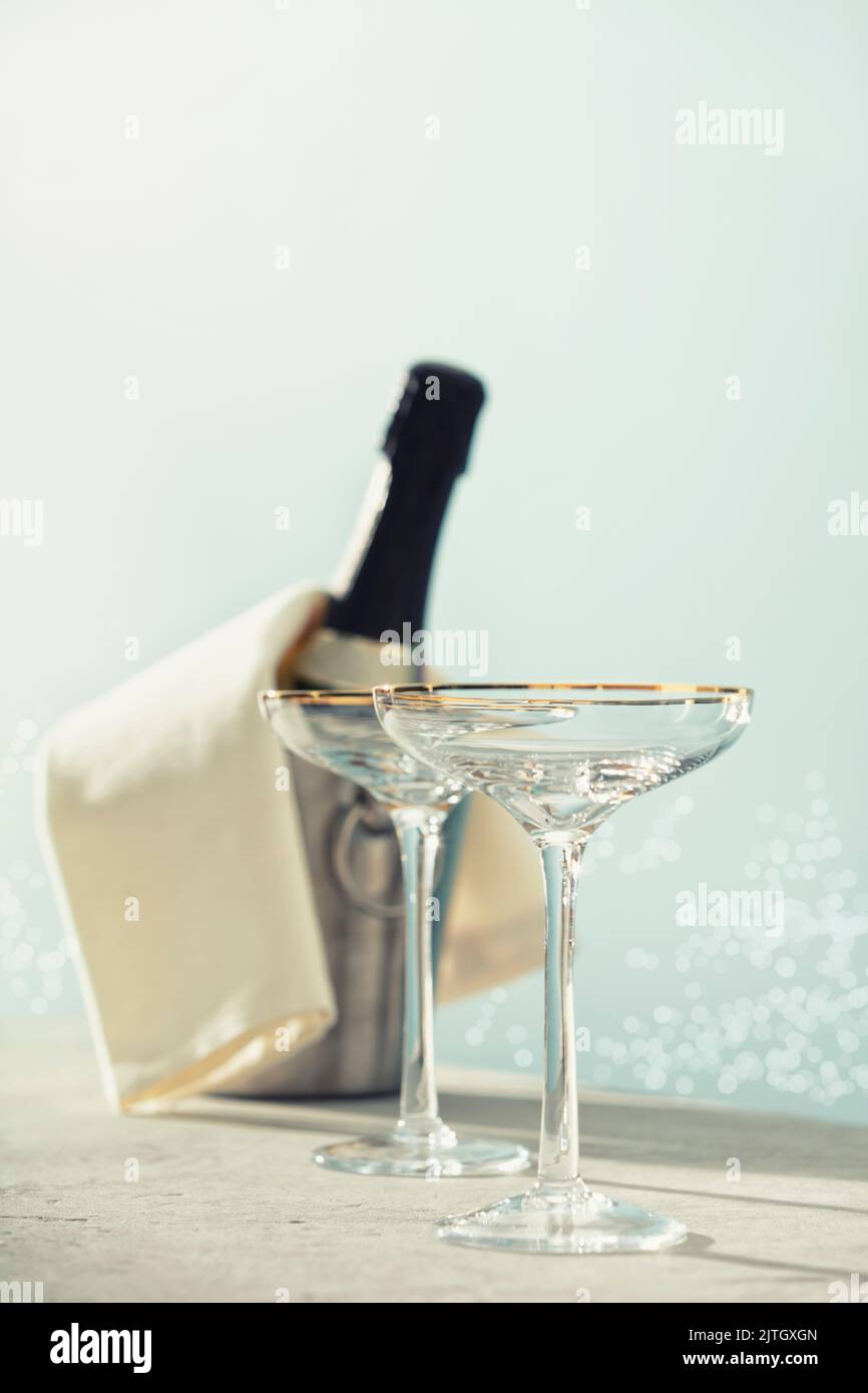 Bottle of champagne and glasses on sea and sky background. Summer holiday and romantic party concept Stock Photo