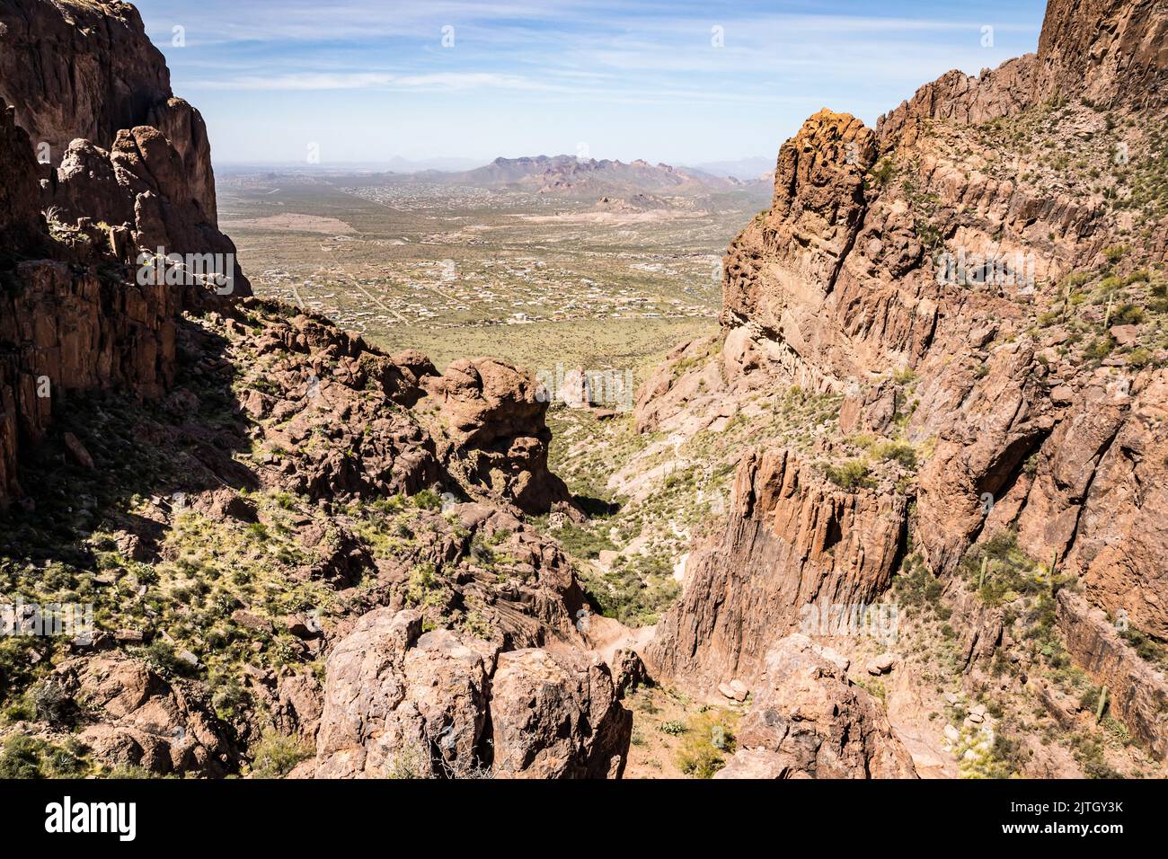 Looking back down on the Siphon Draw Trail in Lost Dutchman State Park, Arizona. Phoenix in the distance. Stock Photo