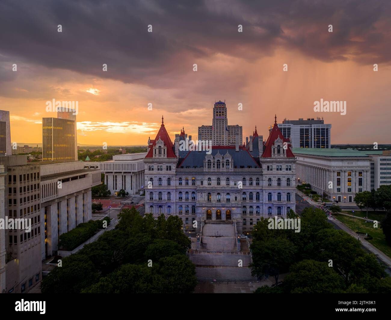 Storm and rain clouds have just passed over the New York State Capitol leaving a stunning colorful sunset in Albany Stock Photo