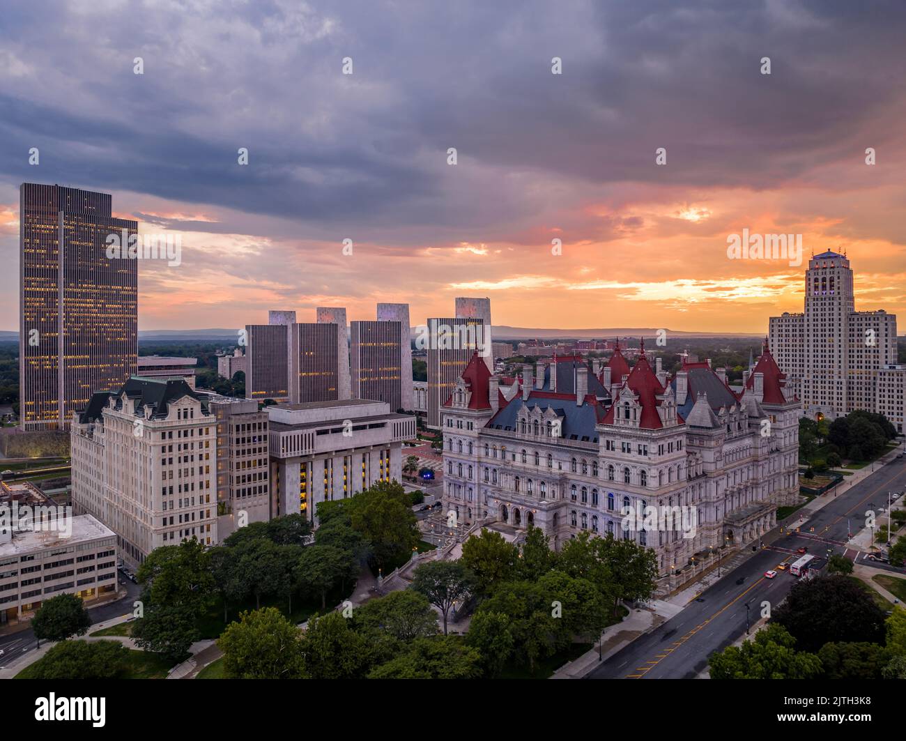 Storm and rain clouds have just passed over the New York State Capitol leaving a stunning colorful sunset in Albany Stock Photo