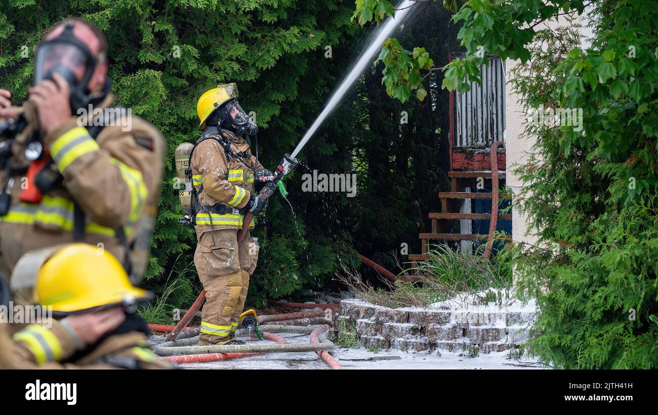 RouynNoranda, Quebec,Canada june 2022 Firefighter fighting a house