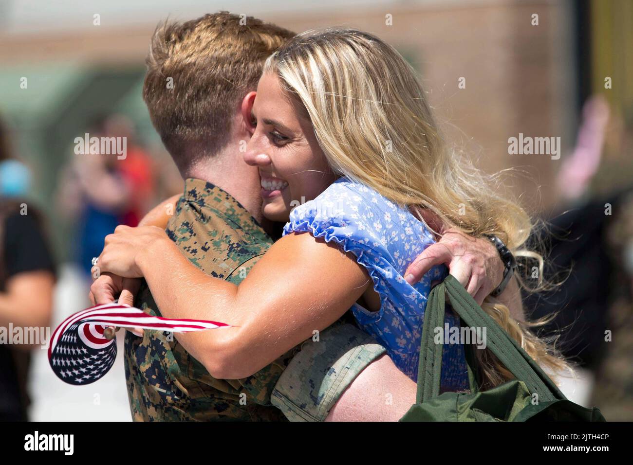 San Diego, California, USA. 12th Aug, 2022. A U.S. Marine with Marine Fighter Attack Squadron 314, Marine Aircraft Group 11, 3rd Marine Aircraft Wing embraces his spouse upon return from deployment aboard the USS Abraham Lincoln at Marine Corps Air Station Miramar, August. 11, 2022. The historic deployment marked the first U.S. Marine Corps F-35C squadron deployed aboard a U.S. Navy aircraft carrier, further assuring 3rd MAW's commitment to providing fixed wing fighter aircraft for deployment as part of U.S. Navy carrier air wings, deploying regularly across the Indo-Pacific region. (Credi Stock Photo
