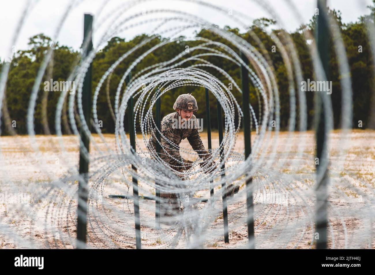 Camp Lejeune, North Carolina, USA. 23rd Aug, 2022. U.S. Marine Corps Cpl. Elijah Ledbetter, a combat engineer with Combat Logistics Battalion 22 (CLB-22), Combat Logistics Regiment 2, 2nd Marine Logistics Group, adjusts concertina wire during a Marine Corps Combat Readiness Evaluation (MCCRE) on Camp Lejeune, North Carolina, August. 23, 2022. CLB-22s MCCRE is the battalion's final evaluation to demonstrate combat readiness through proficiency in core mission essential tasks before they begin a change of operational control (CHOP) to the 26th Marine Expeditionary Unit. (Credit Image: © U.S. Stock Photo