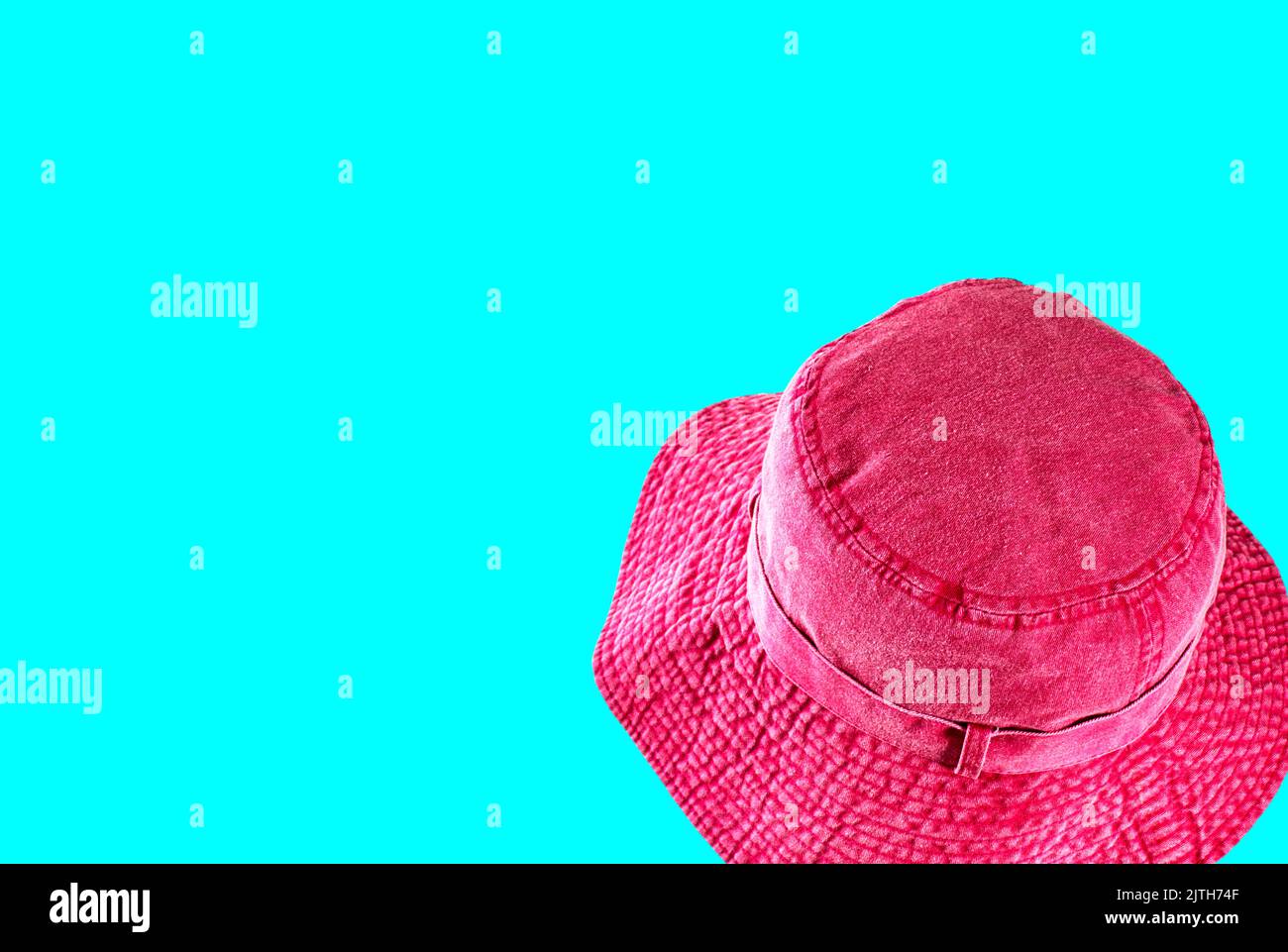 A pink red hat isolated on colored background Stock Photo