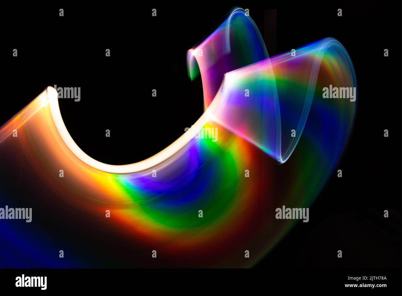 Abstract figure of light forms. Light painting long exposure photo. Free space to write Stock