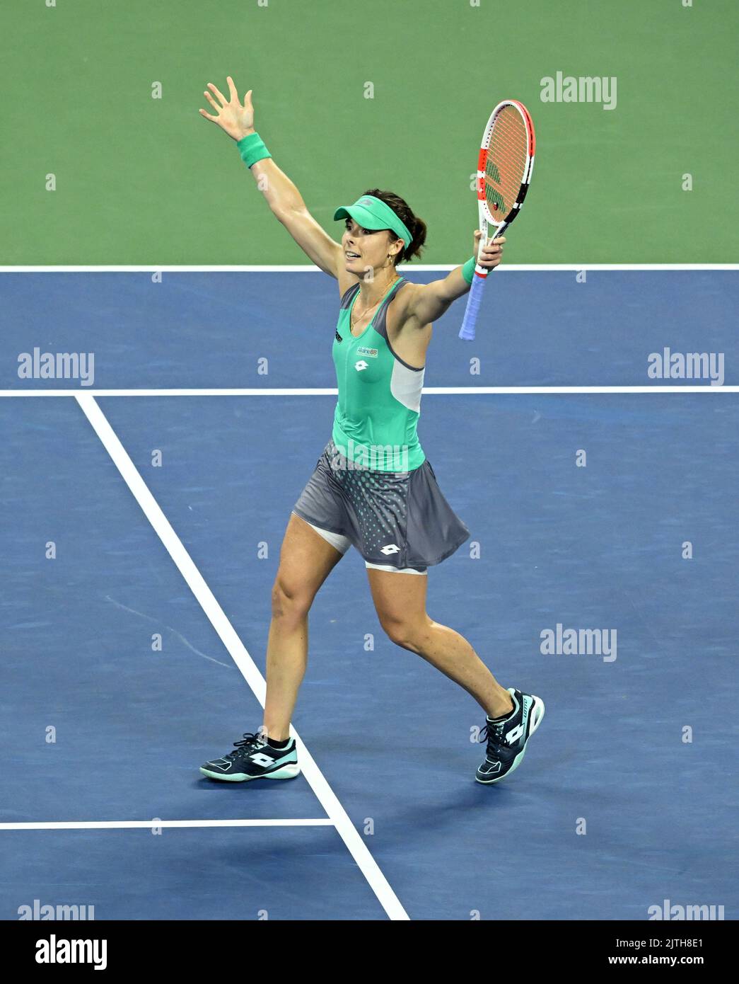 Alize Cornet celebrates beating Emma Raducanu during day two of the US Open at the USTA Billie Jean King National Tennis Center, New York. Picture date: Tuesday August 30, 2022. Stock Photo