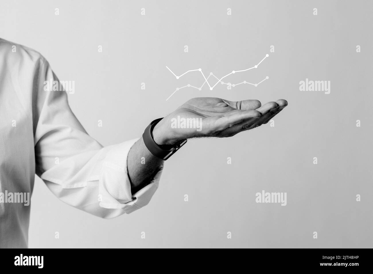 Digital graph with businessman hand overlay Stock Photo