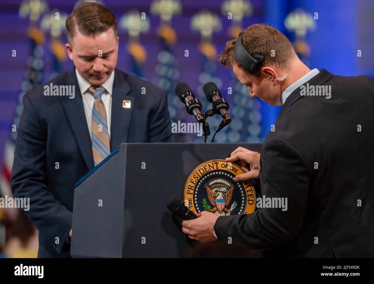 Wilkes Barre, United States. 30th Aug, 2022. White House employees place the presidential seal and notes on the podium. President Joe Biden made a visit to Wilkes-Barre, Pennsylvania to discuss his plan to reform gun control, during his speech he touted beating the NRA. Biden is visiting cities for his Safer America plan. Credit: SOPA Images Limited/Alamy Live News Stock Photo