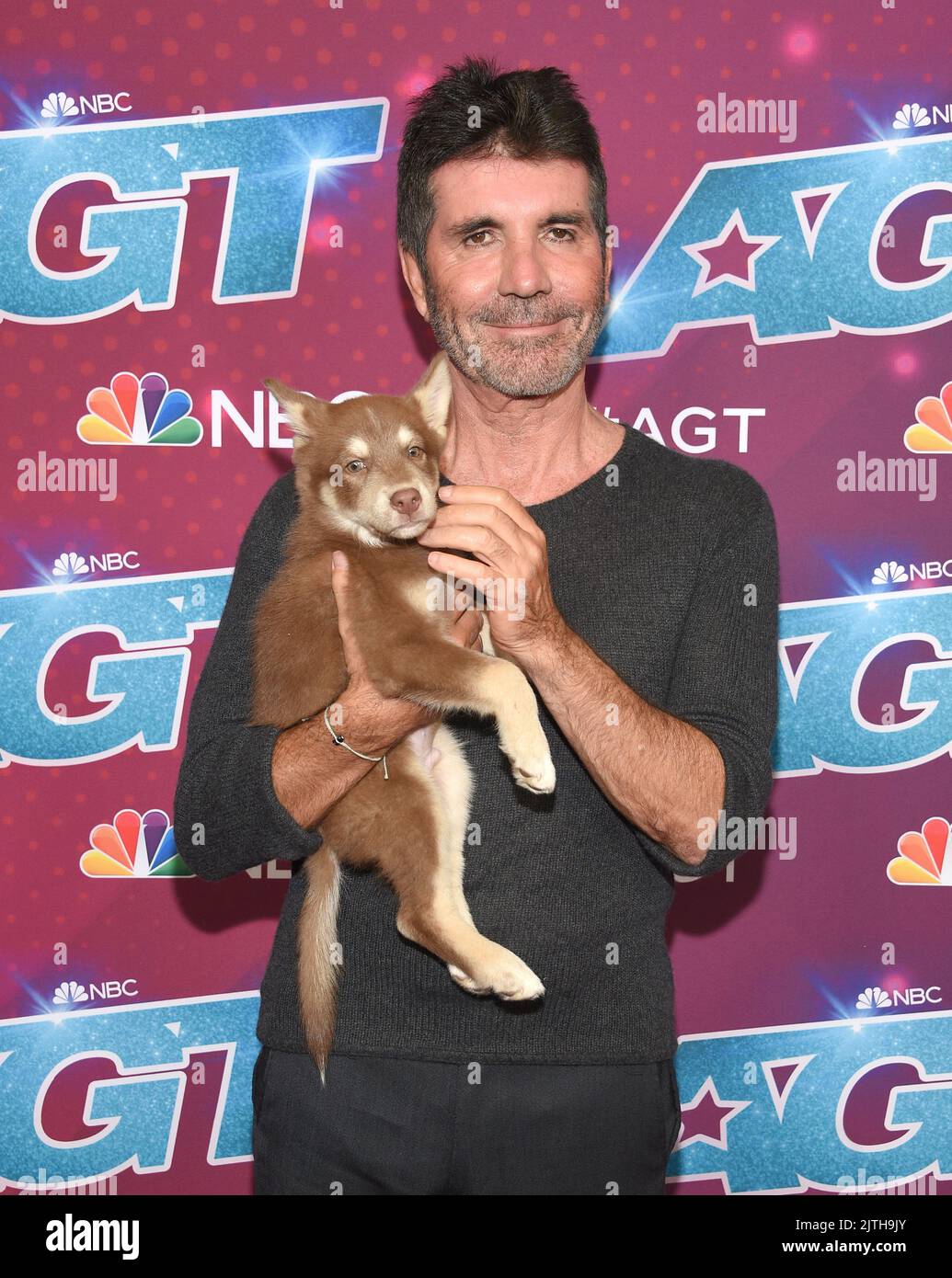 Pasadena, CA, August 30, 2022. Simon Cowell and Odin arriving to ...