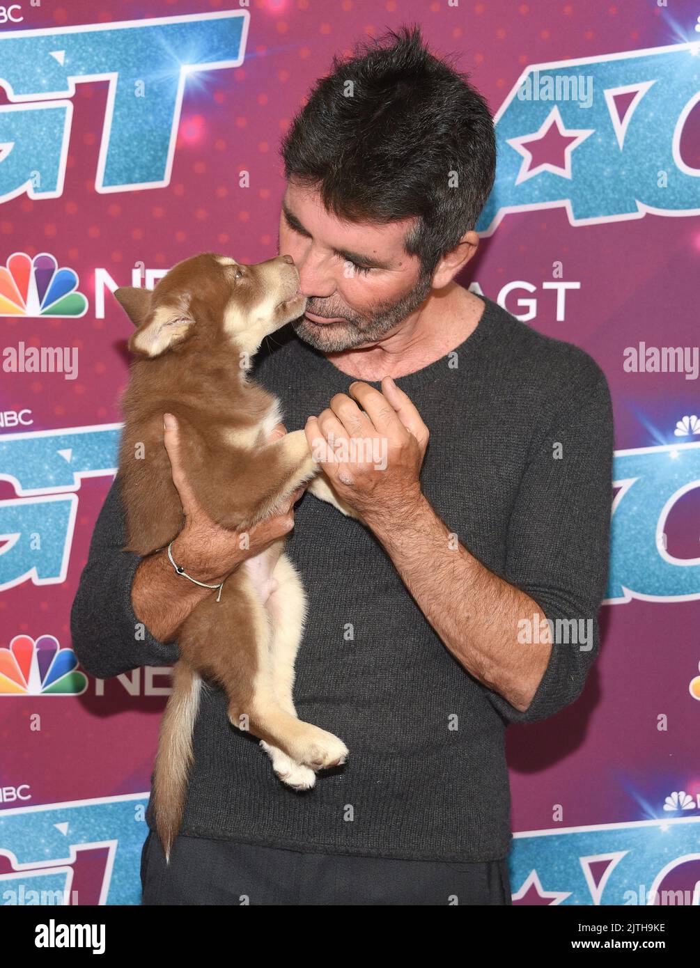 Pasadena, CA, August 30, 2022. Simon Cowell and Odin arriving to ...