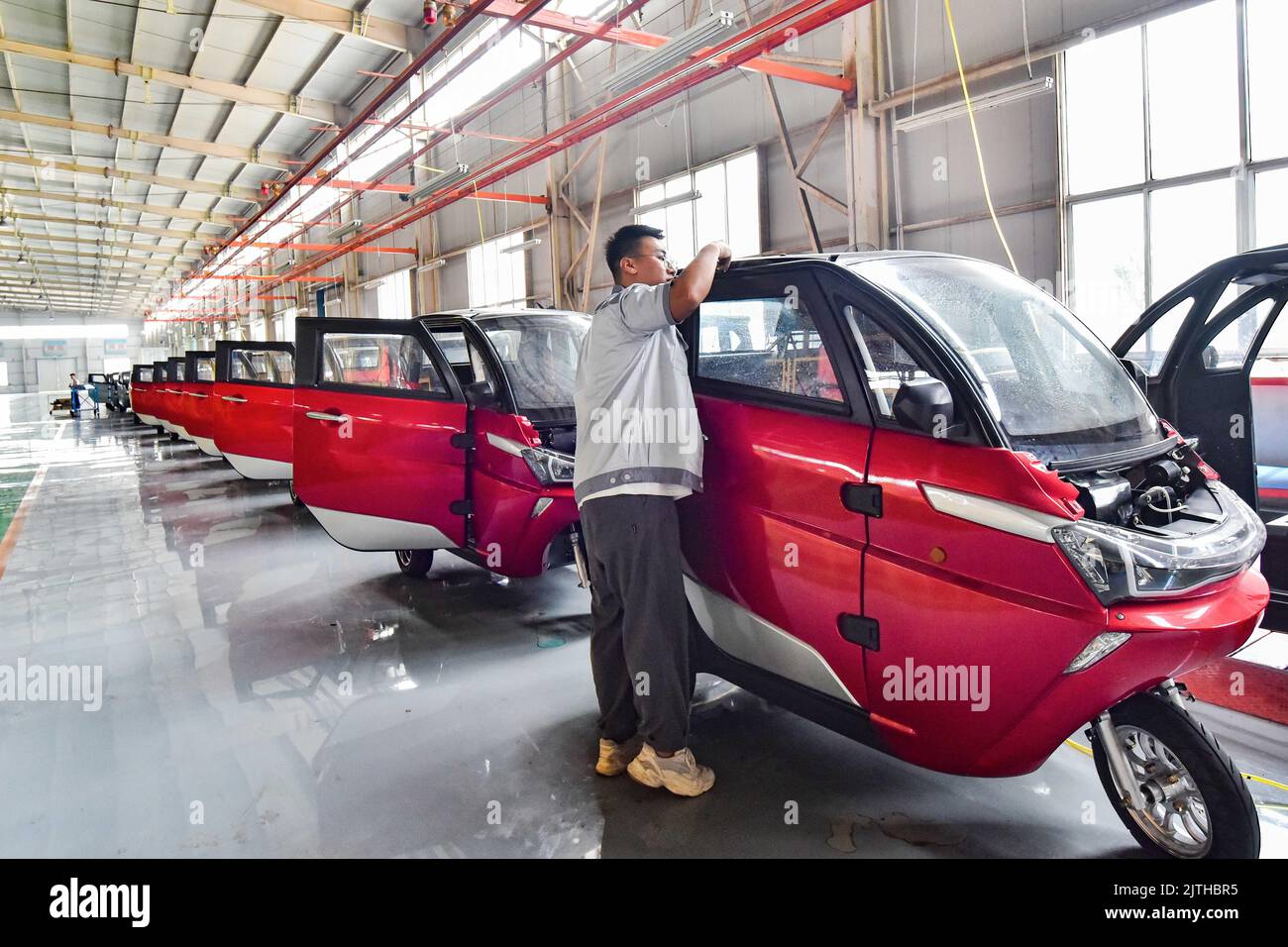 QINGZHOU, CHINA - AUGUST 31, 2022 - Workers assemble at a workshop of ...