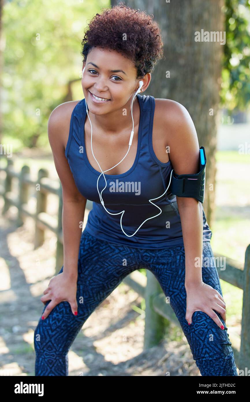 Ready, set, run. Portrait of a sporty young woman out for a run Stock ...