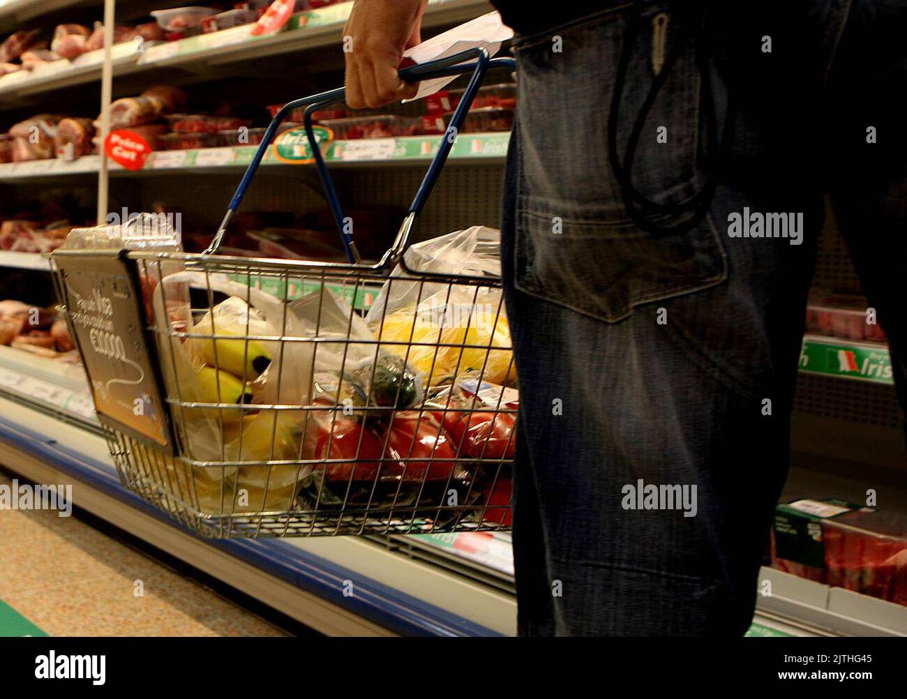 Undated file photo of a man holding a shopping basket in a supermarket. The price of food rose at its fastest rate since 2008 in August as pressure from the war in Ukraine continued to push up costs, figures show. Shop price annual inflation surged to 5.1%, up from 4.4% in July, marking a new record since the British Retail Consortium (BRC) and NielsenIQ index started in 2005. Issue date: Wednesday August 31, 2022. Stock Photo