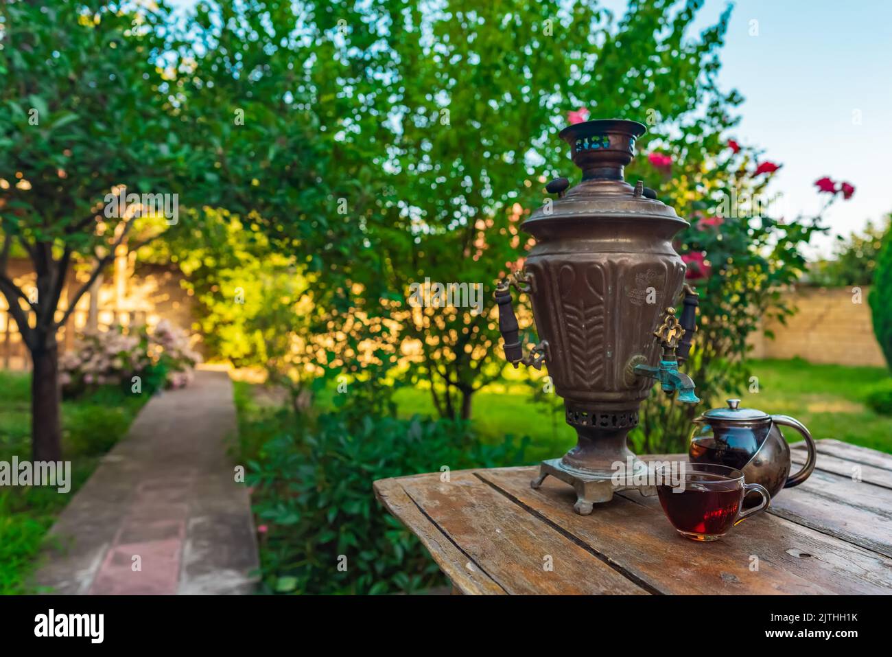 Tea drinking from a vintage samovar in garden Stock Photo
