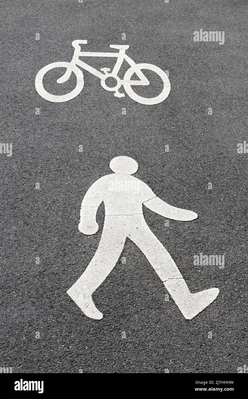 Pedestrian and cyclist sign on tarmac pavement. Stock Photo