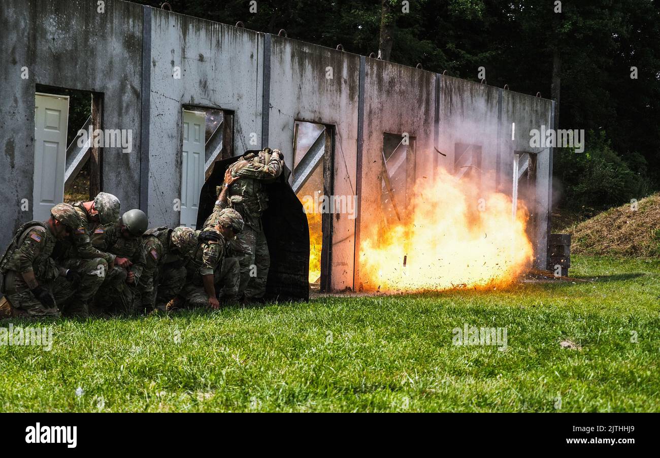 Indiana Guardsmen with the 776th Engineer Battalion, blast through doors during urban breaching training at Camp Atterbury, Indiana, Aug. 19, 2022. Army engineers are experts in mobility, counter-mobility, engineering and survival. (U.S. Army Photo by Sgt. Hector Tinoco) Stock Photo