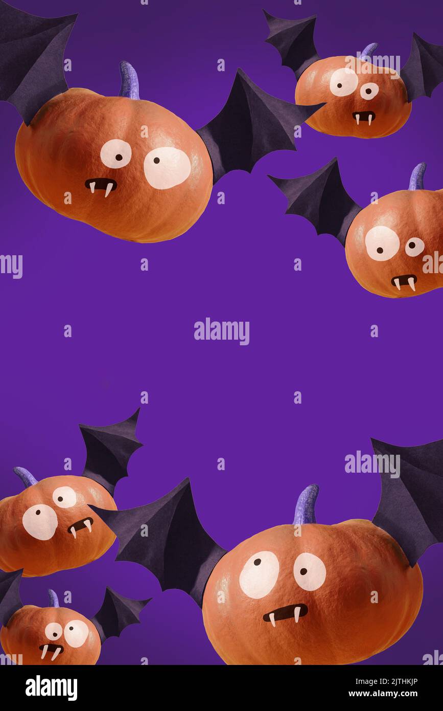Happy Halloween poster, purple party invitation background with bat pumpkins with funny creepy faces. Modern bright orange party backdrop for Hallowee Stock Photo