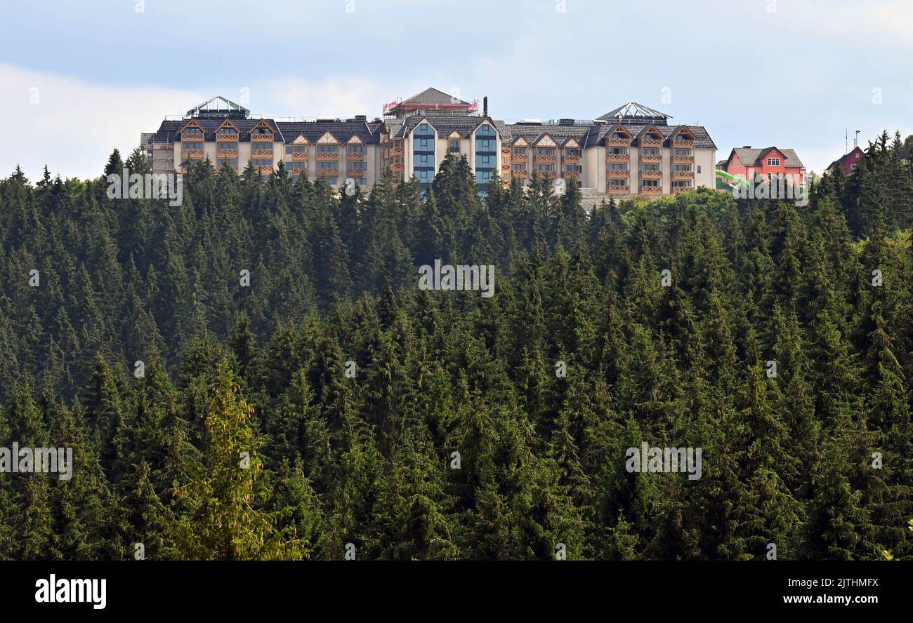 Oberhof, Germany. 30th Aug, 2022. A family hotel is being built in the town center. Construction of the five-star hotel was due to start at the end of 2019, and an Austrian entrepreneur had budgeted around 50 million euros for the new building. The house with 110 rooms and 15 chalets is to open this year. Credit: Martin Schutt/dpa/Alamy Live News Stock Photo