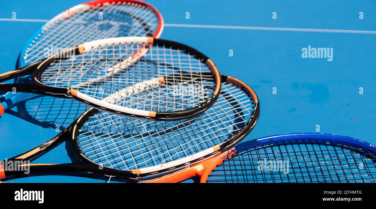 broken tennis rackets on clay tennis court Stock Photo Alamy