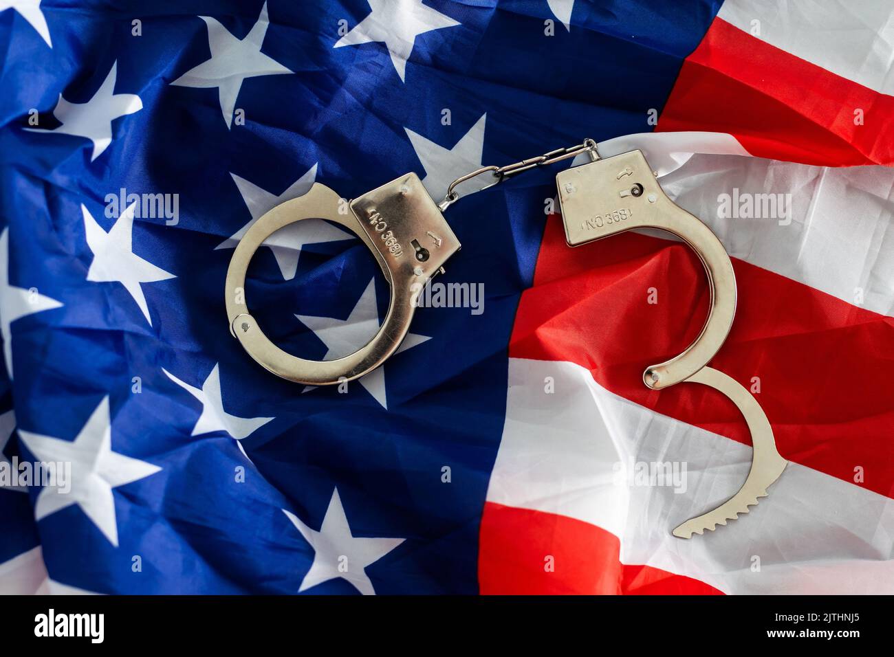 handcuffs on the background of the USA flag, the concept of crime in