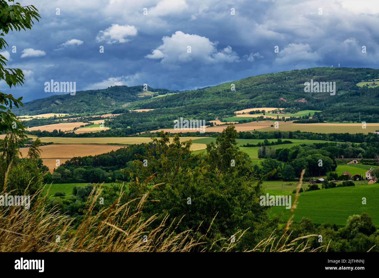 Green color fertile and beautiful landscape of Czech Paradise near town Jicin with dramatic sky. View from hill Zebin, Czech republic. Stock Photo