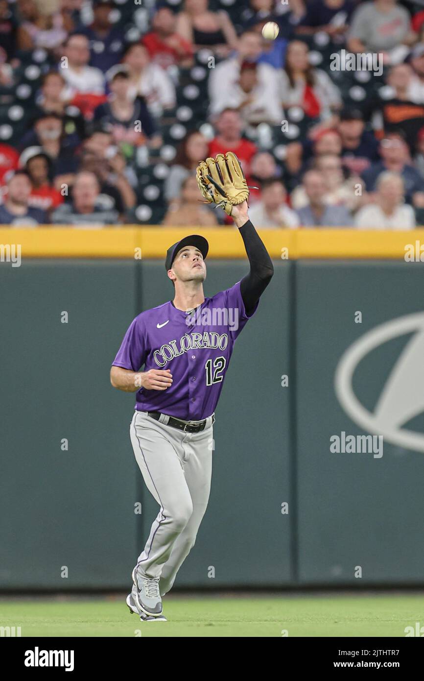 Atlanta, GA. USA;  Colorado Rockies  rookie left fielder Sean Bouchard (12) catches a fly ball for the out during a major league baseball game against Stock Photo