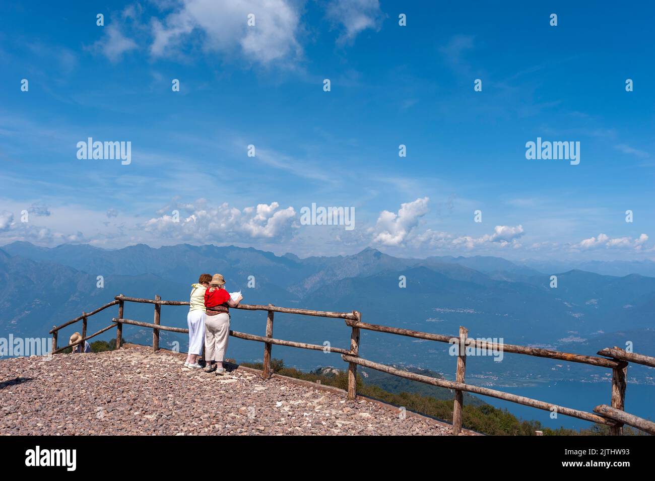 Tourists on the top of Monte Mottarone overlooking Lake Maggiore, Stresa, Piedmont, Italy, Europe Stock Photo