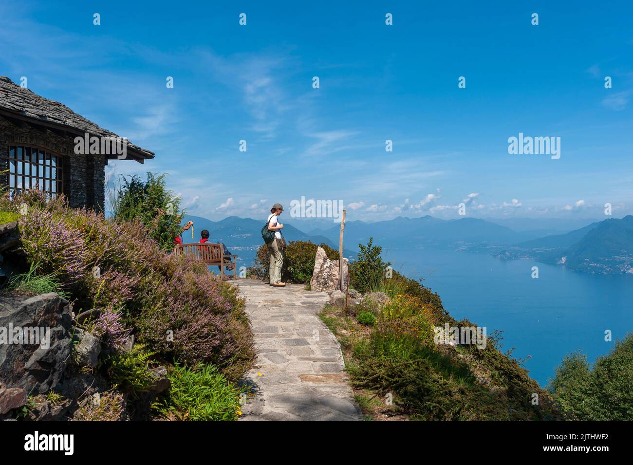 Tourists in the Giardino Botanico Alpinia park overlooking Lake Maggiore, Stresa, Piedmont, Italy, Europe Stock Photo