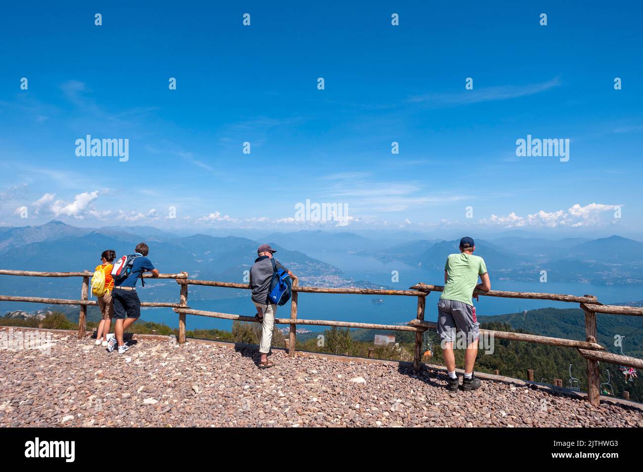 Tourists on the top of Monte Mottarone overlooking Lake Maggiore, Stresa, Piedmont, Italy, Europe Stock Photo