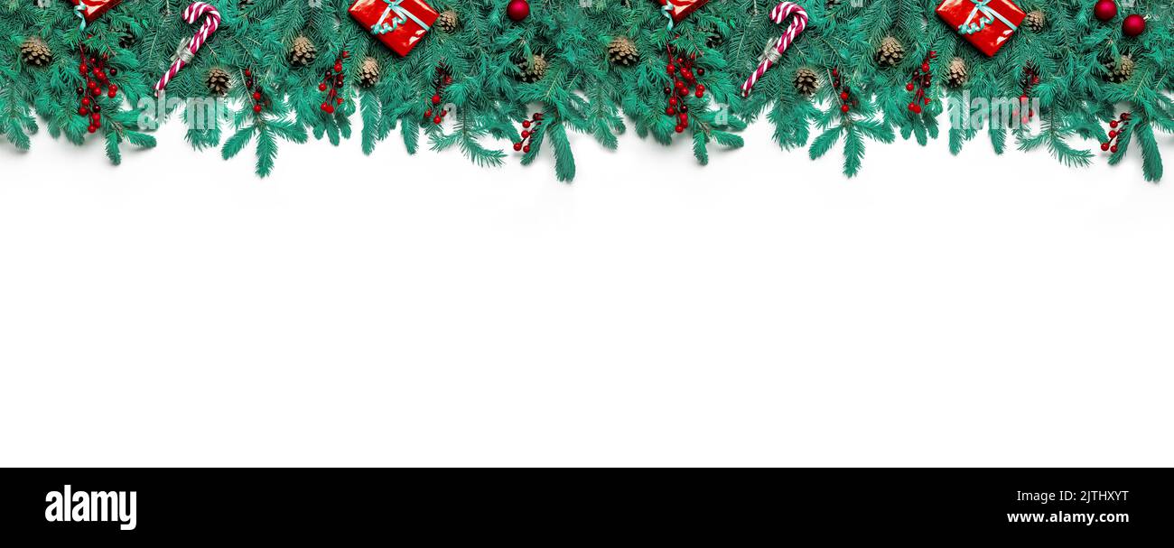 christmas wide panorama banner with pure green natural fir branches isolated on white background. Christmas Border tree branches, horizontal banner. t Stock Photo