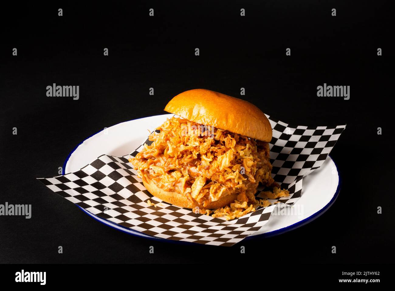 Pulled chicken burger over a black background Stock Photo