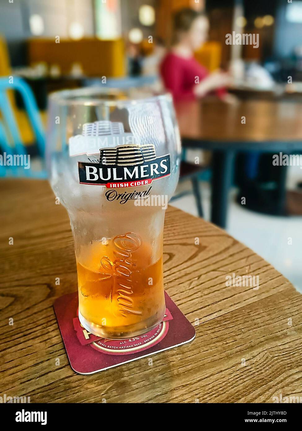 Almost finished pint of Bulmers cider in a bar in Dublin Airport.  (Note that Bulmers is the Irish branding for Magners Cider) Stock Photo