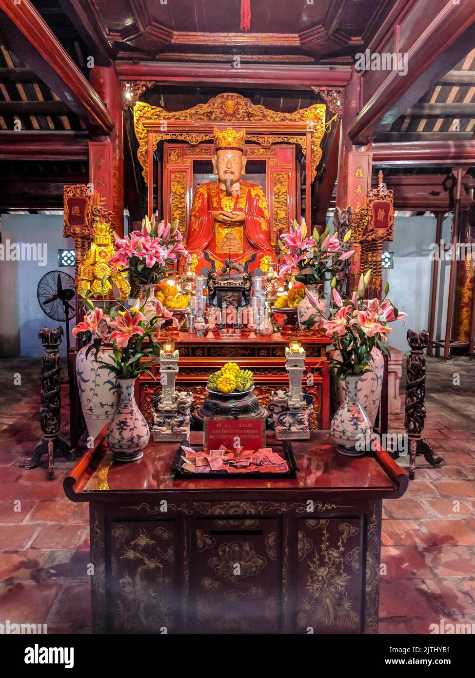 Confucian shrine with flowers and gifts in the imperial city, Hue