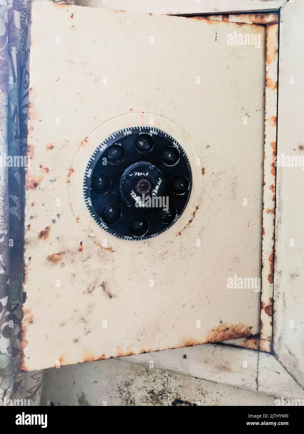 Old, rusty safe in the medical department of an abandoned prison. Stock Photo