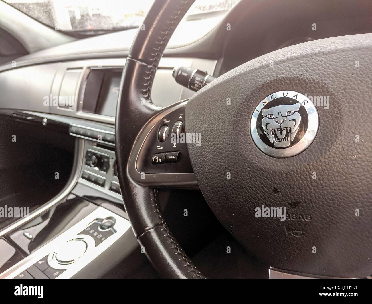 Steering wheel of a Jaguar XF car Stock Photo