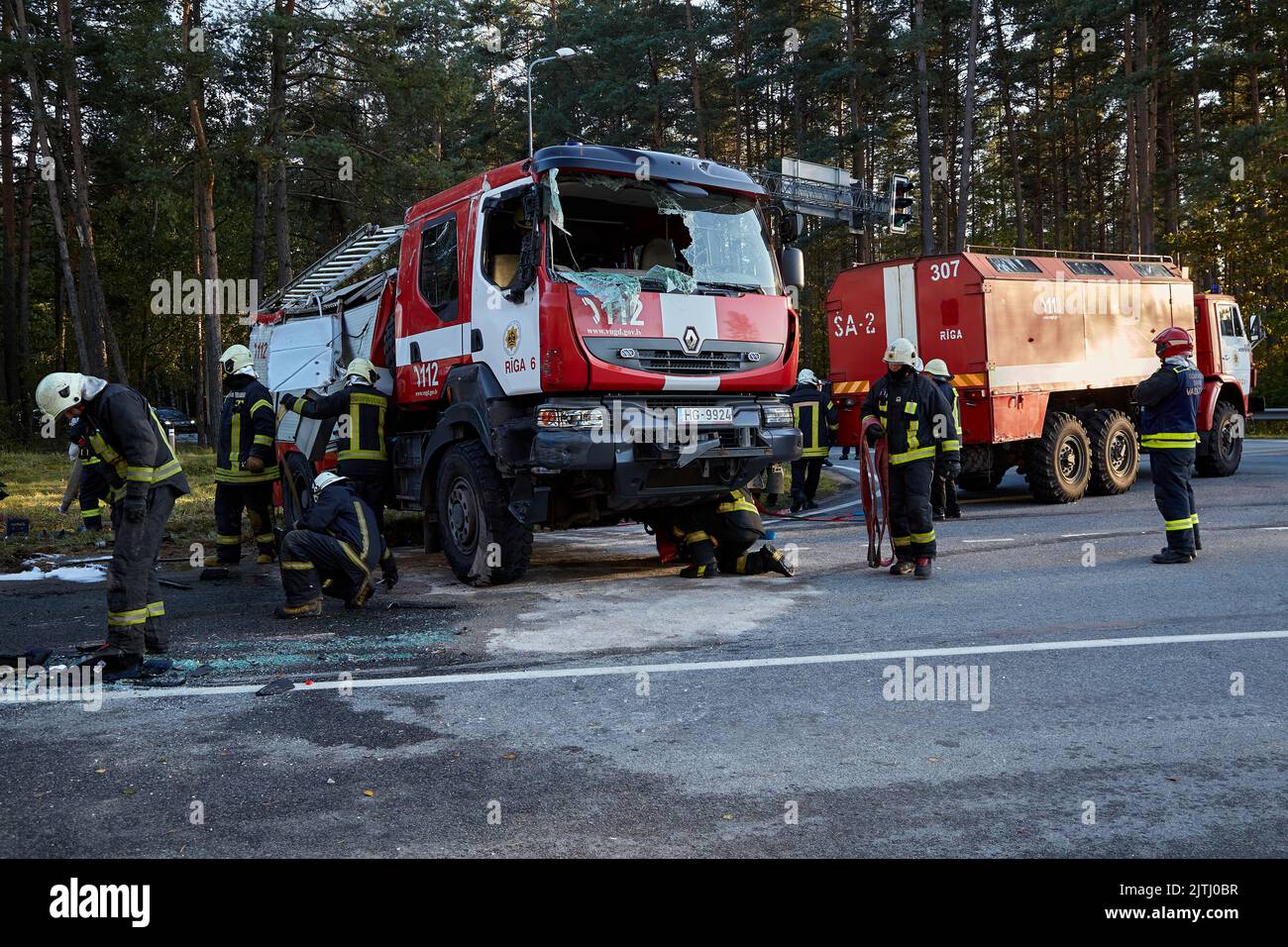 September 30, 2021,Upesciems Latvia: car accident on a road, fire truck after a collision with a car, transportation background Stock Photo