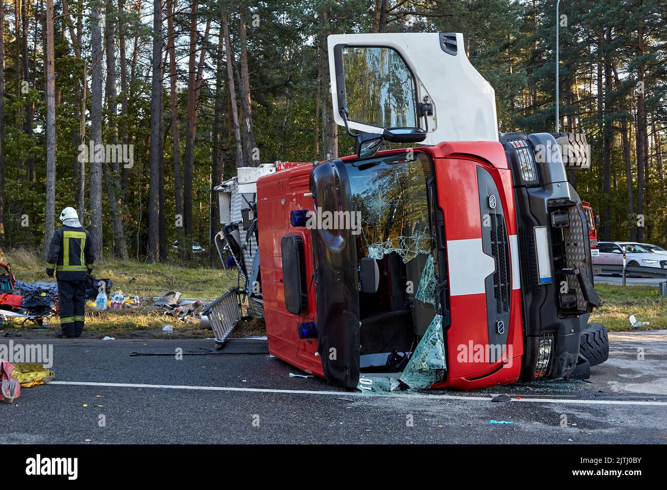 September 30, 2021,Upesciems Latvia: car accident on a road, fire truck after a collision with a car, transportation background Stock Photo