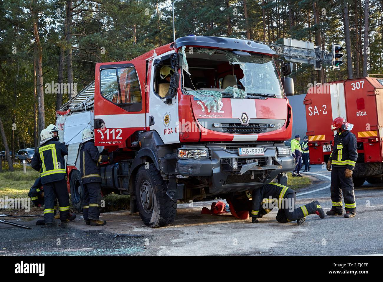 September 30, 2021,Upesciems Latvia: car accident on a road, fire truck after a collision with a car, transportation background Stock Photo