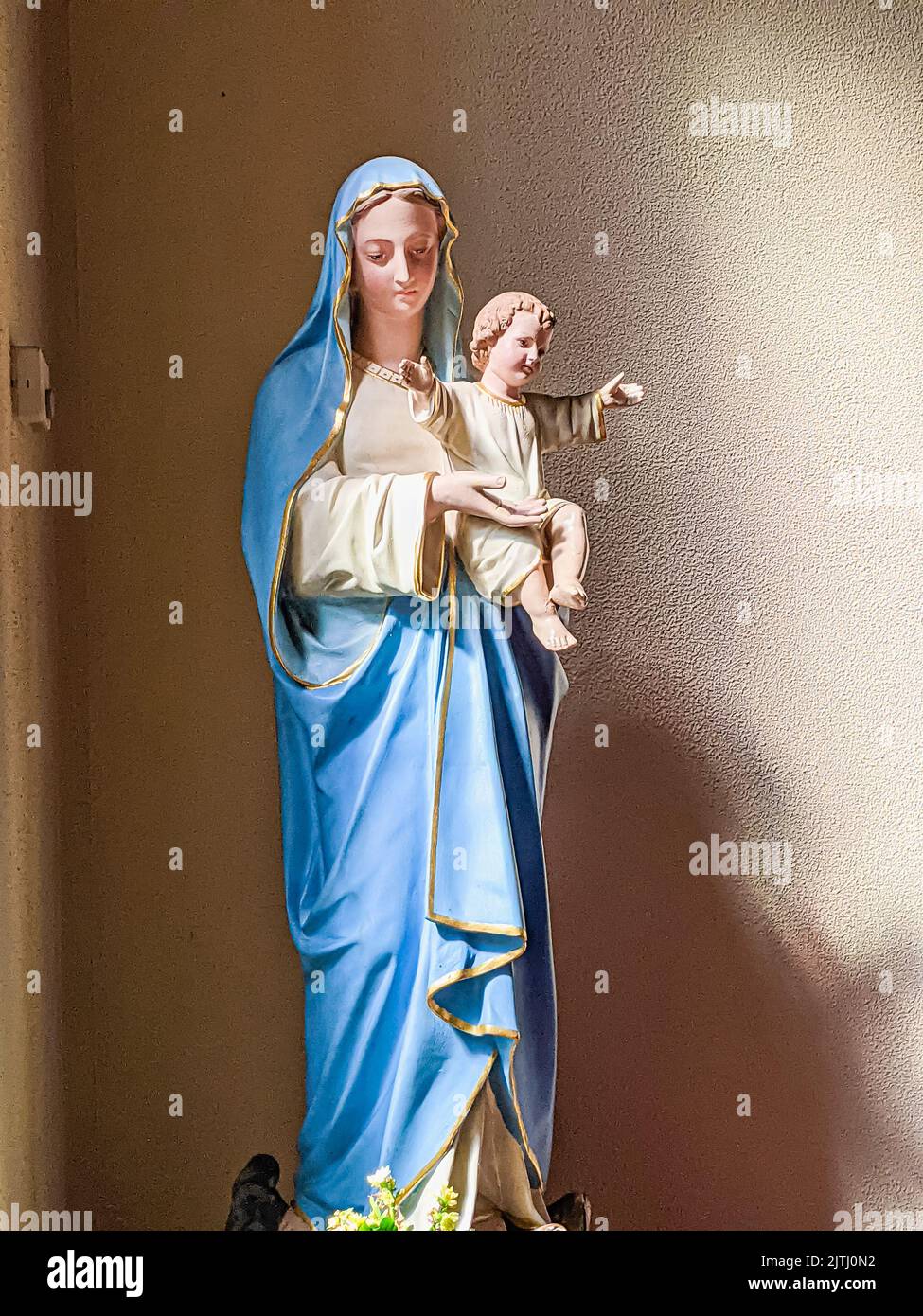 Statue of Saint Mary and Jesus inside a church building, Northern Ireland. Stock Photo