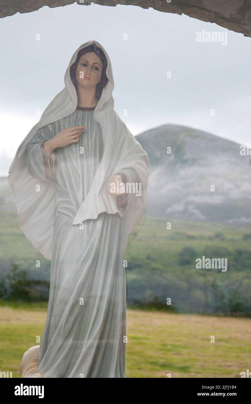 Shrine to the Virgin Mary at the foot of Croagh Patrick, from where Saint Patrick is said to have banished the snakes and lizards from Ireland, County Mayo, Republic of Ireland Stock Photo