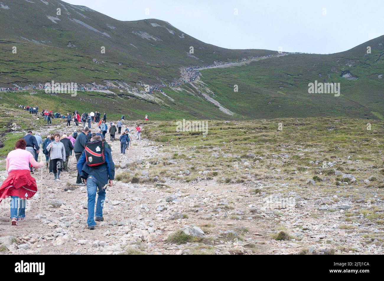 'Reek Sunday', a guelling pilgrimage up Croagh Patrick, County Mayo on the last Sunday in July each year, to visit the location where Saint Patrick stayed for 40 days, and from where his was said to have banished the lizards and snakes from Ireland. Stock Photo