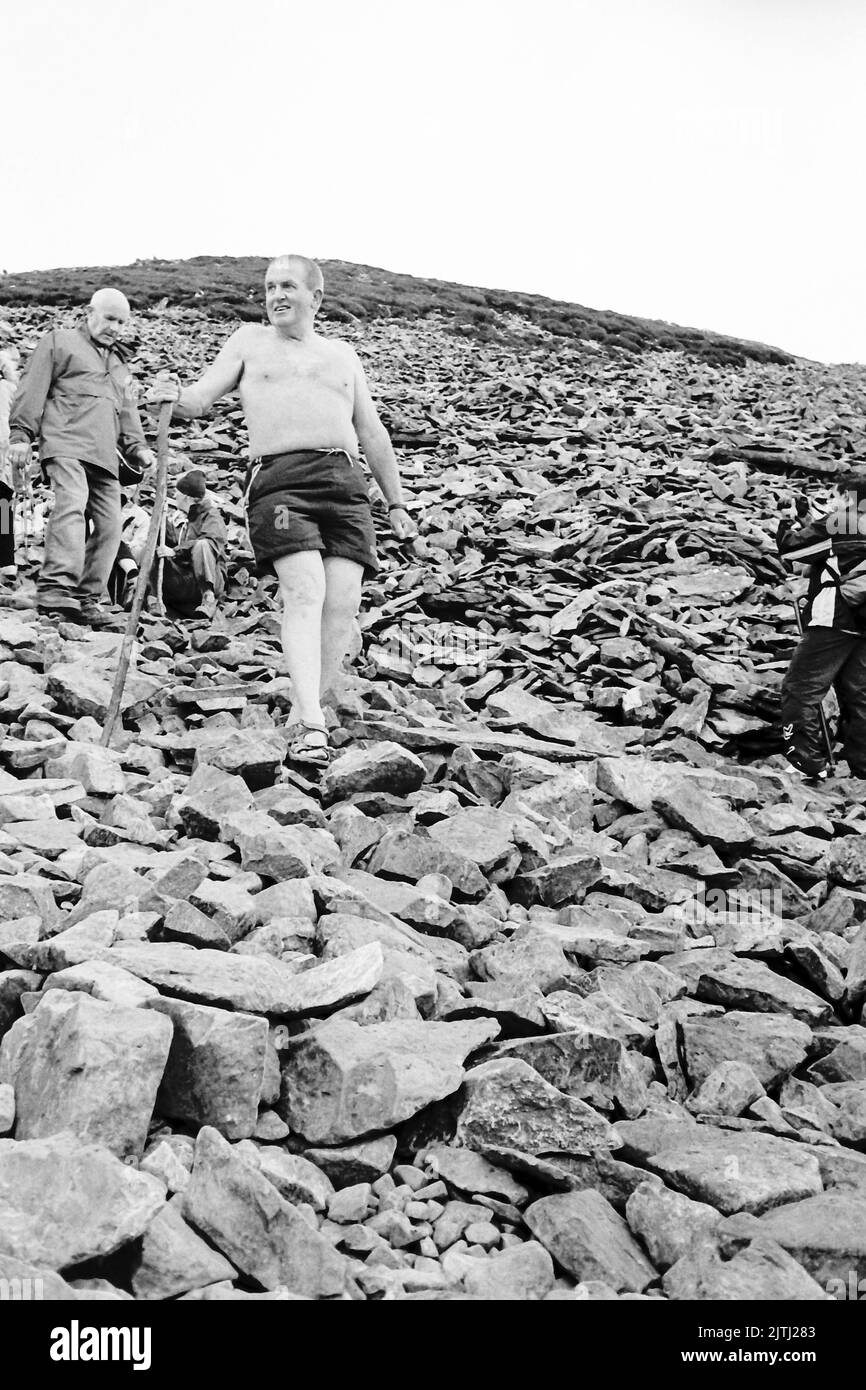 Black and white film footage of 'Reek Sunday', a guelling pilgrimage up Croagh Patrick, County Mayo on the last Sunday in July each year, to visit the location where Saint Patrick stayed for 40 days, and from where his was said to have banished the lizards and snakes from Ireland. Stock Photo