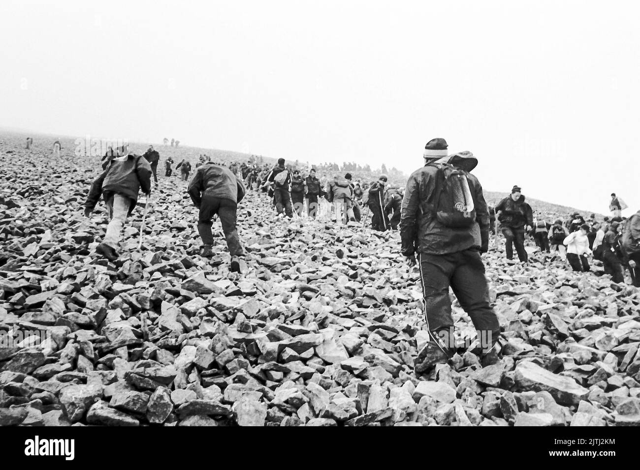 Black and white film footage of 'Reek Sunday', a guelling pilgrimage up Croagh Patrick, County Mayo on the last Sunday in July each year, to visit the location where Saint Patrick stayed for 40 days, and from where his was said to have banished the lizards and snakes from Ireland. Stock Photo